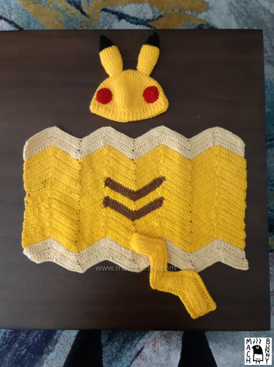 Pikachu hat and blanket set, showing the blanket fully opened.